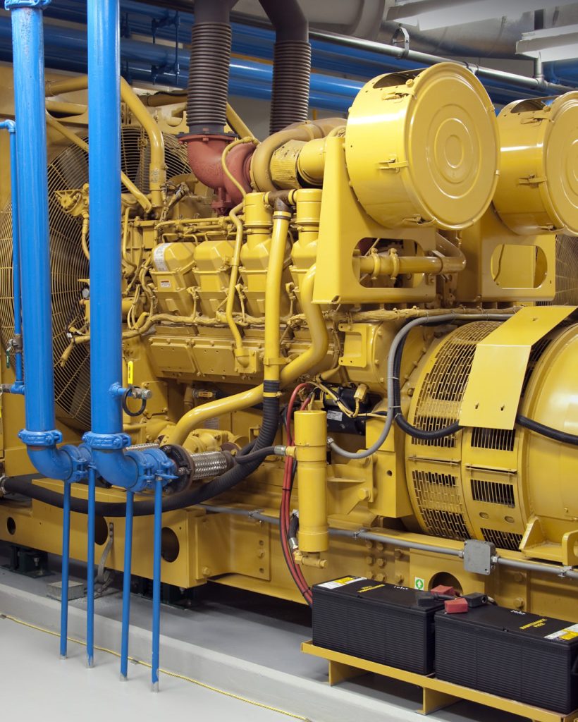 Maintenance contractor checking diesel generators
